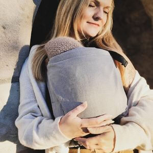 Buckle baby carrier while cuddling